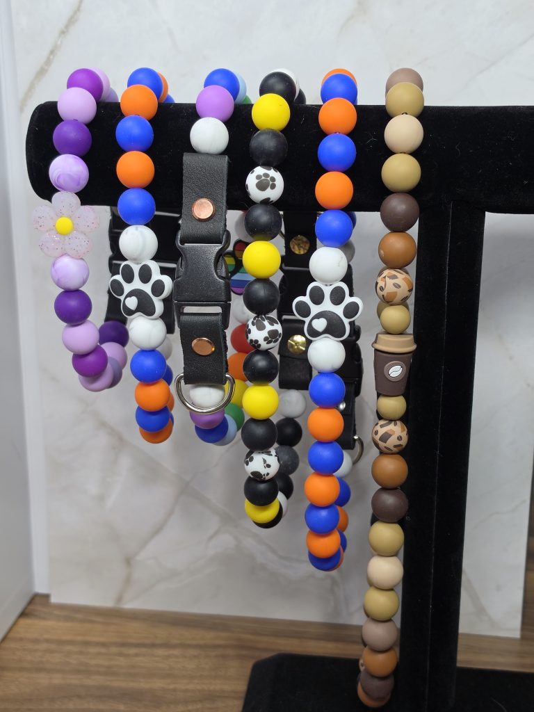 beaded dog collars on a stand